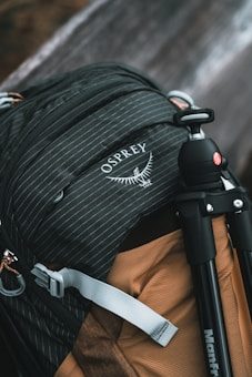 A close up of a backpack with a camera attached to it